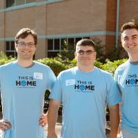 three volunteers outside honors college